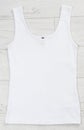 White tank top back view tshirt template mock up on white wooden background top view Royalty Free Stock Photo