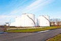 White tanks for petrol and oil in tank farm with blue sky Royalty Free Stock Photo