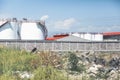 white tanks in tank farm with blue sky. Royalty Free Stock Photo