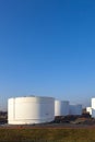 White tanks in tank farm with blue sky Royalty Free Stock Photo