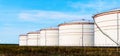 White tanks in tank farm with blue sky Royalty Free Stock Photo