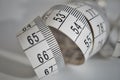 White tape measure tape measuring length in meters and centimeters on the isolated surface as symbol of tool used by tailor Royalty Free Stock Photo