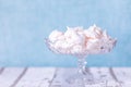 White tasty Meringe with blue background Royalty Free Stock Photo