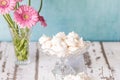 White tasty Meringe with blue background Royalty Free Stock Photo