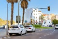 White taxi cars are parked, traffic lights. Blanes