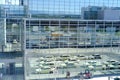 white taxi cars with yellow signs at the entrance are waiting for air passengers, Frankfurt, Germany - August 2022