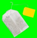 White Tea Bag with yellow label Royalty Free Stock Photo