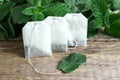 White tea bags with mint leaves Royalty Free Stock Photo