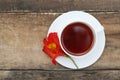 White Tea Cup Orange Red Flower Alstromeria Astromeria over Rustic Wooden Background. Copy space Royalty Free Stock Photo