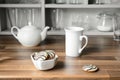 White tea cup, teapot and cookies Royalty Free Stock Photo