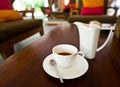 White tea pot and cup on the table