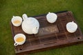 White tea pot and tea cups. Royalty Free Stock Photo