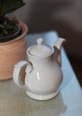 White tea pot on the table Royalty Free Stock Photo