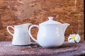 White tea pot on wood background Royalty Free Stock Photo