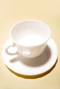 White teacup and saucer