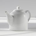 White teapot on white background with shadow Royalty Free Stock Photo
