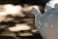 White teapot on a blurred background Royalty Free Stock Photo