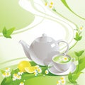 White teapot and cup with green tea.