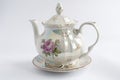 White teapot painted with rose