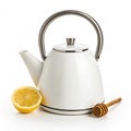 White teapot with silver handle next to lemon half and honey dipper kettle Royalty Free Stock Photo