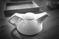 White teapot on the table in restaurant Royalty Free Stock Photo