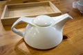 White teapot on the table in restaurant Royalty Free Stock Photo