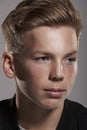 White teenage boy looking away, close up portrait, vertical Royalty Free Stock Photo