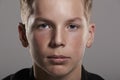 White teenage boy looking to camera, close up, horizontal Royalty Free Stock Photo