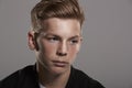 White teenage boy looks away, head and shoulders, horizontal Royalty Free Stock Photo