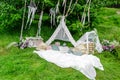 A white teepee tent in the forest