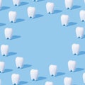 White teeth pattern on a blue paper background with text place