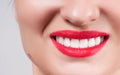 White teeth and red lips. Perfect female smile after whitening teeth. Royalty Free Stock Photo