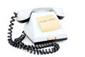 White telephone with sticky note