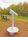 white telescope for distant viewing in park alongside Housatonic River in Fall colors