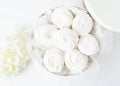 White tender marshmallow in a white box on a light background. Traditional holiday gift. Copy space. Royalty Free Stock Photo