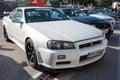 white tenth generation Nissan Skyline GT R34 in a Japanese car meet