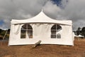 White tents in a dry field outdoors Royalty Free Stock Photo
