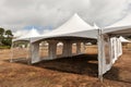 White tents in a dry field outdoors Royalty Free Stock Photo