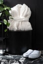 White terry bathrobe and slippers in bathroom Royalty Free Stock Photo