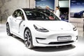 White Tesla Model 3 at Brussels Motor Show, produced by American automaker Tesla, main shareholder Elon Musk