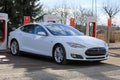 White Tesla Model S Electric Car Being Charged Royalty Free Stock Photo