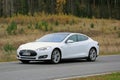 White Tesla Model S on the Road in October Royalty Free Stock Photo