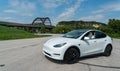 White Tesla Model Y at Pennybacker bridge in Austin Texas