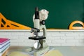 White test rat sitting on microscope. Concept - testing of drugs, vaccines, laboratory animals, humanity, genetic Royalty Free Stock Photo