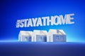 A white textblock ` STAYATHOME` above model houses in front of blue background Royalty Free Stock Photo