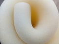 White texture rough and porous sponge foam rolled Royalty Free Stock Photo