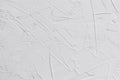 White textured background of filler paste applied with putty knife in irregular strokes Royalty Free Stock Photo