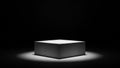 White Cube Pedestal with Textured Surface Under a Spotlight on Dark Background display platform Royalty Free Stock Photo