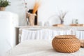 The white textured kitchen is blurred in the background in the style of shabby. A large table in an ecological style and loft Royalty Free Stock Photo