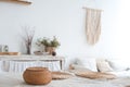 White textured kitchen in the style of shabby. A large table in an ecological style and loft style. Rustic shelves, napkins, old r Royalty Free Stock Photo